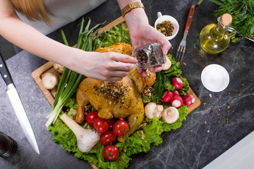 Chef woman hands cooking chicken or turkey in modern comfortable kitchen in restaurant. Cooking, food, restaurant concept