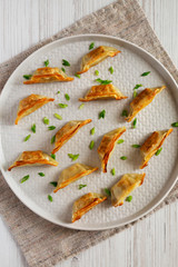 Homemade japanese gyoza on a plate, top view. Overhead, from above, flat lay.