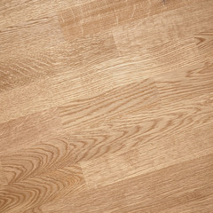 Fine natural solid valuable species of wood laminate parquet floor texture background. Wooden boards painted with natural oil, wax or mastic.