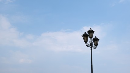cast-iron lantern against the blue sky