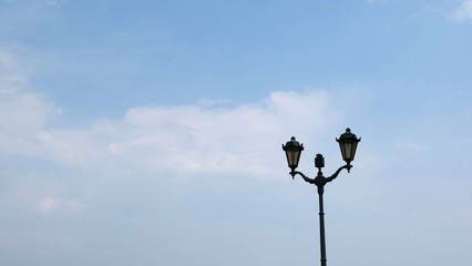 cast-iron lantern against the blue sky