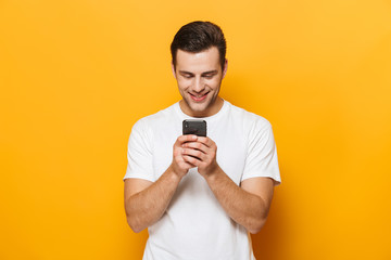 Portrait of a happy young man wearing t-shirt standing