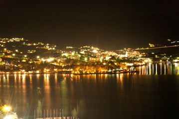 Fototapeta na wymiar night city by the sea in lights