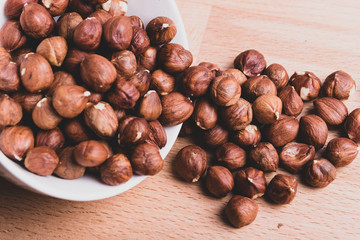 Hazelnuts in a bowl close-up. Healthy food.