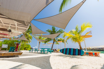 Outside lounging relax vacation beach bar blue paradise sea and coconut tree in travel easy slow...
