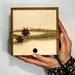 natural eco wooden box decorated with coffee beans, rope, anise