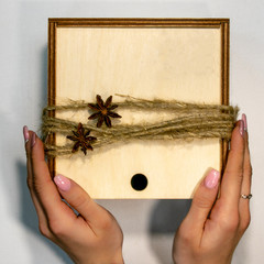 natural eco wooden box decorated with coffee beans, rope, anise