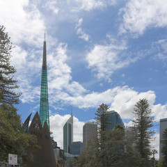 Bells tower and skyscrapers  in Perth city against blue sky, Western Australia