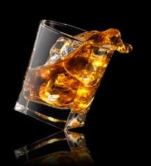 splash of whiskey in glass