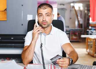 portrait of a working man at printer studio