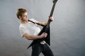 Man playing on electric guitar