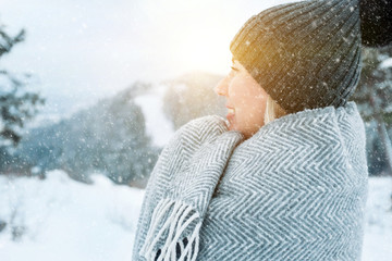 Portrait Happy woman traveler on the snowy of mountain look on t