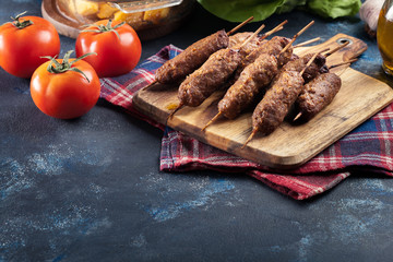Grilled balkan cevapcici or  kebab on skewers