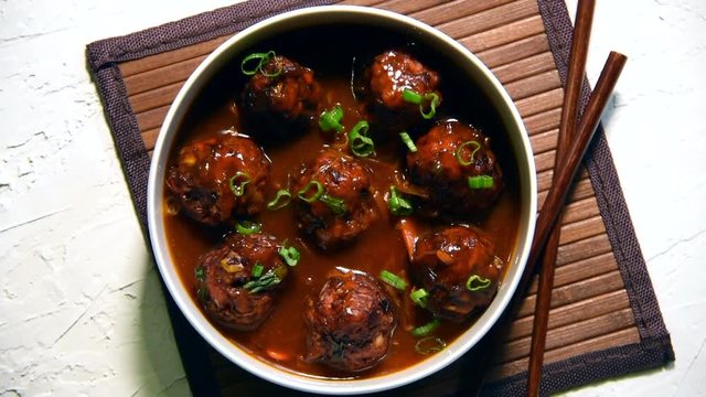Manchurian balls with gravy - Popular food of India made of cauliflower florets or chicken
