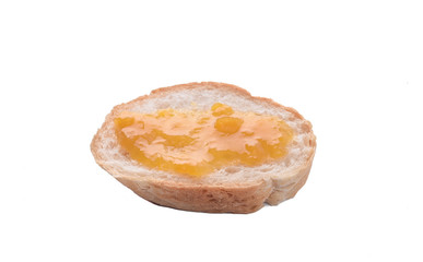 Sliced of sourdough Loaf with mango jam on top isolated on white background