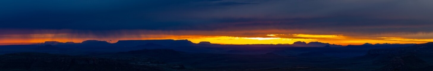Fototapeta na wymiar Stormy sunrise with mountain silhouette