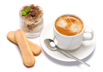 Classic tiramisu dessert in a glass and cup of coffee isolated on a white background with clipping path