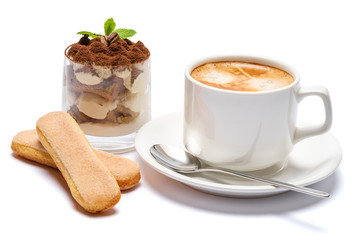 Classic tiramisu dessert in a glass and cup of coffee isolated on a white background with clipping path