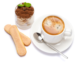 Classic tiramisu dessert in a glass and cup of coffee isolated on a white background with clipping path