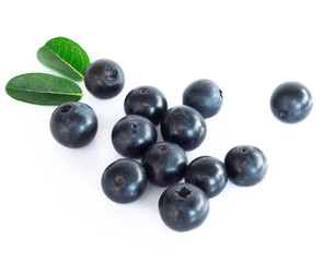 Fresh blueberries with green leaves isolated on white background