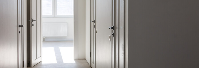 Empty white interior with door