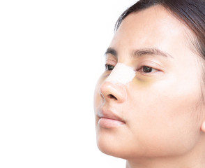 Close up face of asian woman with nose plastic surgery for beauty and cosmetic conept, white background