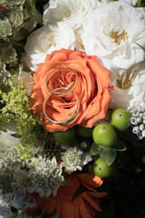 wedding rings on bouquet of flowers