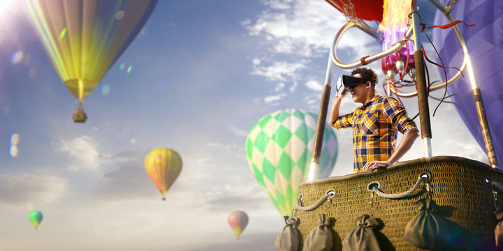 Beautiful young man trying VR headset and exploring another world and enjoy