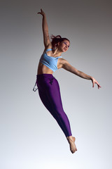 athletic jumping girl studio shot