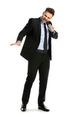 Obraz premium Handsome male singer with microphone on white background