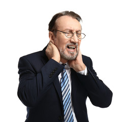 Portrait of handsome mature businessman suffering from neck ache on white background