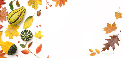 Autumn layout composition frame of dry leaves, branch, yellow green pumpkins, acorn and berries on white background, Flat lay, top view, copy space, fall concept.