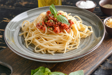 Plate with tasty boiled pasta on table