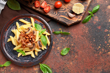 Plate with tasty boiled pasta on color background