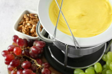 Cheese fondue on table