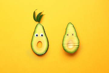 Creative composition with avocado on color background