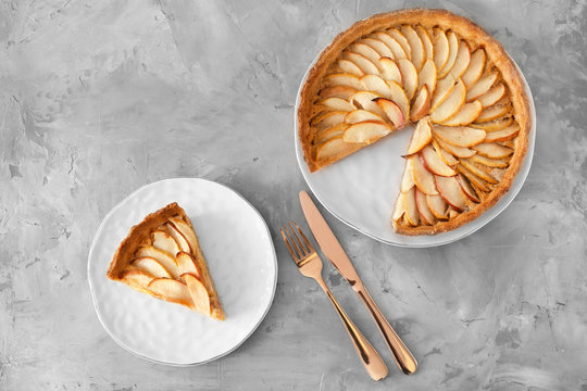 Composition with tasty apple pie on table