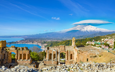 Ancient Greek theatre in Taormina on background of Etna Volcano, Italy - obrazy, fototapety, plakaty