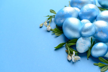 Beautiful Easter eggs on color background