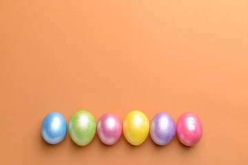 Beautiful Easter eggs on color background