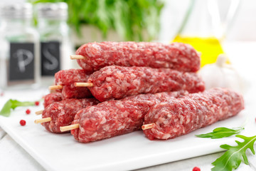 Raw lula kebab on skewers