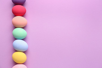 Beautiful Easter eggs on color background