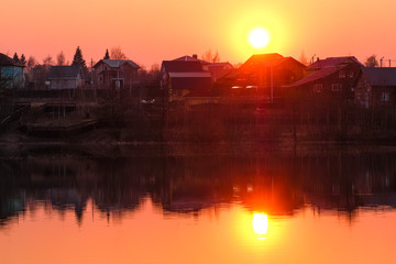 Obraz premium Landscape with the image of spring lake at sunset