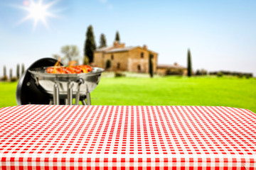 Desk of free space and summer time in garden with grill. 