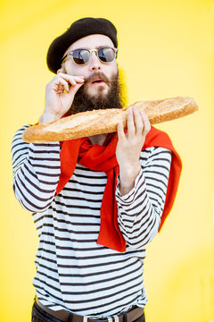 picture French Mustache Guy https stock adobe com images portrait of a stylish man dressed in french style with striped shirt hat and red scarf on the yellow background 265283043 start checkout 1 content id 265283043