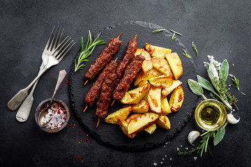 Grilled shish kebab with baked potato