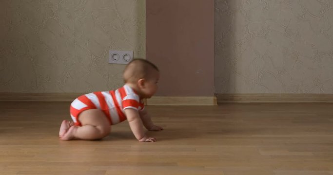 Baby crawling for the first time at home