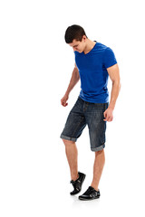 Full photo of young athletic sportsman stretching muscles and legs