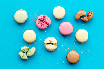 Macarons design on blue background top view pattern