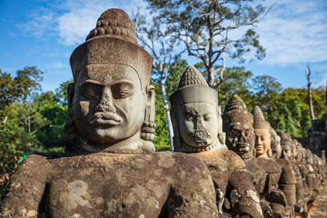 Head sculptures on the bridge leading to the south gate at Angkor Thom temple complex, Siem Reap, Cambodia